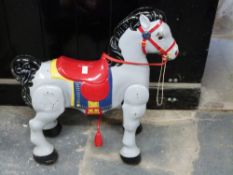Mobo tin plate toy horse and a doll's pram