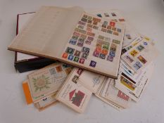 A collection of Dutch stamps comprising a stockbook, loose album pages, first day covers - loose and