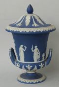 Wedgwood Jasperware covered pedestal twin-handled urn decorated with classical scenes, H 23cm