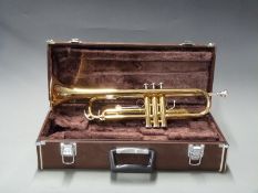Yamaha cased trumpet c1990s, reg no YTR 2320E 311584, with original manual, accessories etc