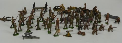 Fifty seven Britains and similar lead and diecast model army soldiers including motorcycle riders,