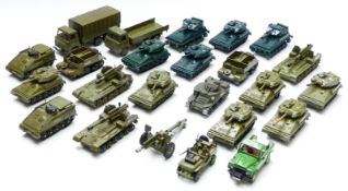 Twenty-four Dinky Toys diecast model military vehicles including tanks, personnel carriers etc