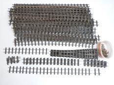 Thirty-one long lengths of 32mm gauge garden railway track, five sets of points and further