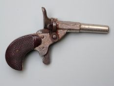 Blank firing .22 hammer action muff pistol with chequered bakelite grips and 2.25 inch part
