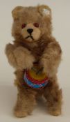 West German clockwork mohair covered tinplate drummer bear with original label to ear and key,