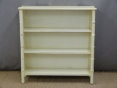 A white painted bookcase with two shelves, H96 x W95 x D28cm
