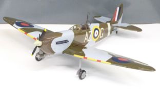 Kit built petrol powered radio controlled model Spitfire aeroplane together with the plans,