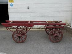 A 19thC four wheel hand cart with carved writing to wheels and frame 'Fitzalan St, SE11' 'On Hire'