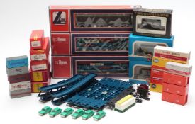 Sixteen various 00 gauge model railway wagons including motorail, TTR caboose and fruit car etc,