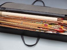 A large collection of vintage wooden arrows and blanks and two tourist spears