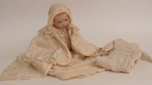 Armand Marseille bisque headed doll with weighted blue eyes, closed mouth and jointed composite