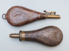 Sykes metal and brass powder flask, 20cm long together with a leather shot flask with embossed