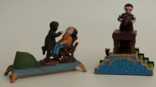 Two novelty cast metal mechanical money boxes Magician Bank and a Dentist removing a tooth