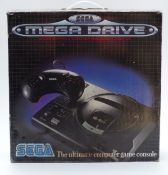 Sega Mega Drive video games console, in original box.