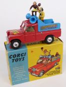 Corgi Toys diecast model Chipperfields Circus Landrover Parade Vehicle with red body, lemon