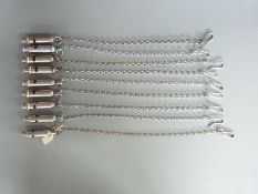 Eight ARP J Hudson whistles and chains together with an Acme Scout whistle