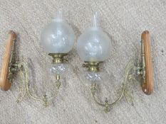 Pair of  19th century gilt metal wall lamps with scrolling support, glass reservoir and etched glass