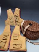 Two Stearns life preservers/fishing jackets and a wicker creel