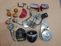 A quantity of motorcycle spares including indicators, chaincase etc