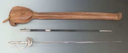 An early 20thC court sword with etched blade, leather scabbard and carry case, blade length 81cm.