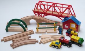 A collection of Brio track, figures and cars