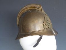 French early 20thC brass fireman's helmet with liner and chin strap