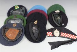 A small collection of military berets including Gloucestershire Regiment, Royal Marines etc together