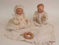 Two Armand Marseille bisque headed twin dolls both with weighted eyes, open mouths, jointed