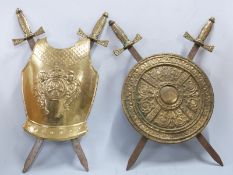 Two brass shield and crossed sword wall hangings, height 75cm
