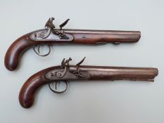 A pair of Lowther of London flintlock hammer action duelling or target pistols named locks, with