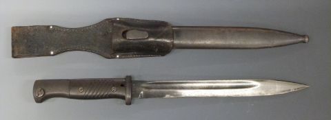WWII German K98 bayonet stamped 3524 to the 25cm blade with matching number scabbard and leather