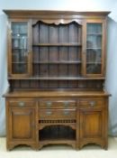 Art Nouveau oak and ash glazed dresser with four drawers and cubby hole. W169 x D48 x H222cm