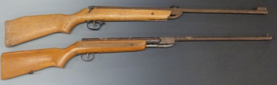 Two .22 air rifles, one Rellum serial number 74820, both with semi-pistol grips and raised cheek