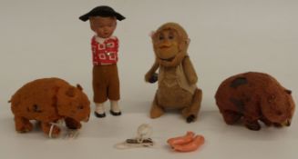 Four clock work toys comprising two Japanese mohair covered tinplate bears, a similar monkey and a