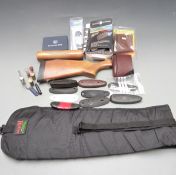 A collection of shotgun parts and accessories including a stock and forend for a Remington semi-