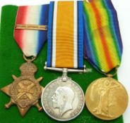 British Army WWI medals comprising 1914 'Mons' Star with clasp, War Medal and Victory Medal, named
