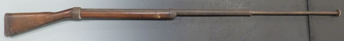 British sprung bayonet training or practice rifle with wooden stock stamped 1915, 161cm long.