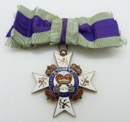 A hallmarked silver gilt and enamel medal 