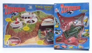 Vivid Carlton Thunderbirds Tracy Island Electronic Playset and Six Vehicle Super Set, both in