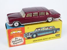 Corgi Toys diecast model Mercedes Benz 600 Pullman with maroon body, cream interior and operating