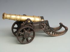 Brass barrelled desk or signalling cannon with 11.5 inch graduated multi-stage barrel on cast iron
