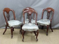 Set of four Victorian upholstered mahogany spoon back dining chairs with moulded splats raised on