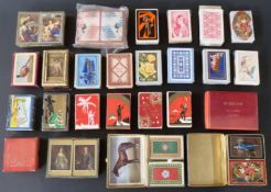 A quantity of English playing cards with decorative and patterned backs