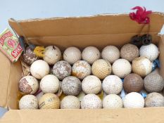 Twenty seven early Gutha Percha and later collectable golf balls together with a cricket and golf
