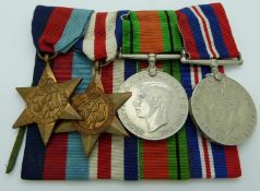 British Army WWII medals comprising the 1939/1945 Star, France & Germany Star, War Medal and Defence