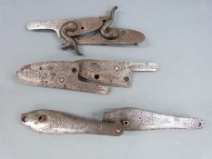 Three pairs of gun locks, all with engraved decoration, each approximately 11cm long.