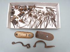 A collection of gun parts and spares including springs, rotary underlever, trigger guard, brass butt