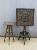 A 19thC carved oak tilt top table and a carved Indian table with ivorine plaque 'Walsh & Co,