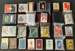 A quantity of English playing cards with advertising related backs