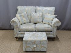 Modern two seater sofa with gold flock upholstery, footstool and cushions. W144 x D91 x H100cm